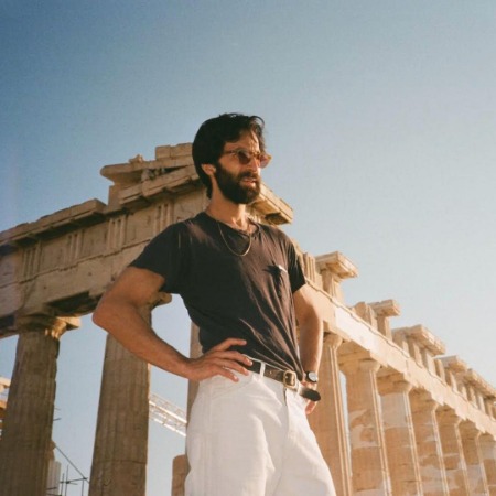 Ariel Schulman is posing for the photo.